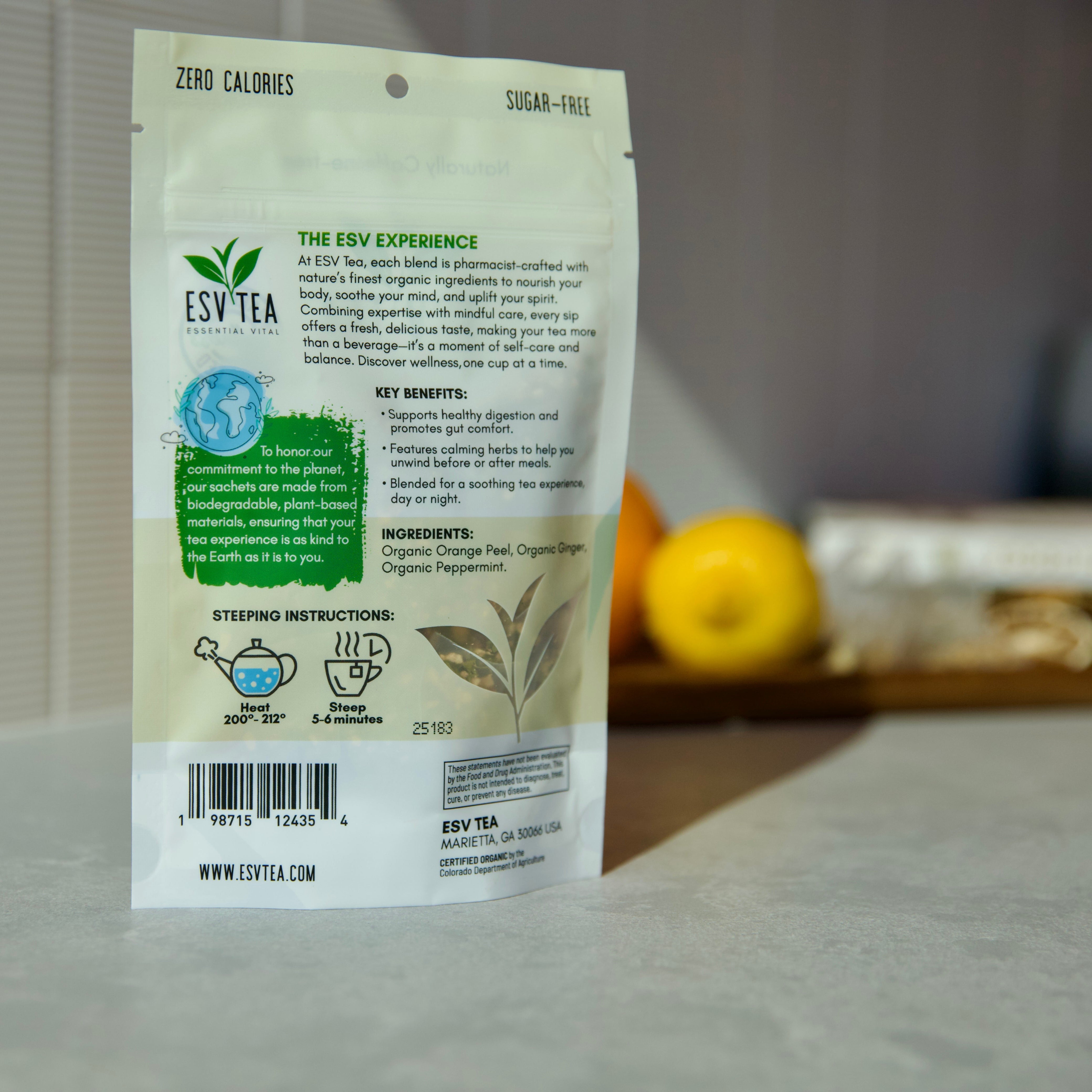 Tea package with branding and text on a surface with a blurred background